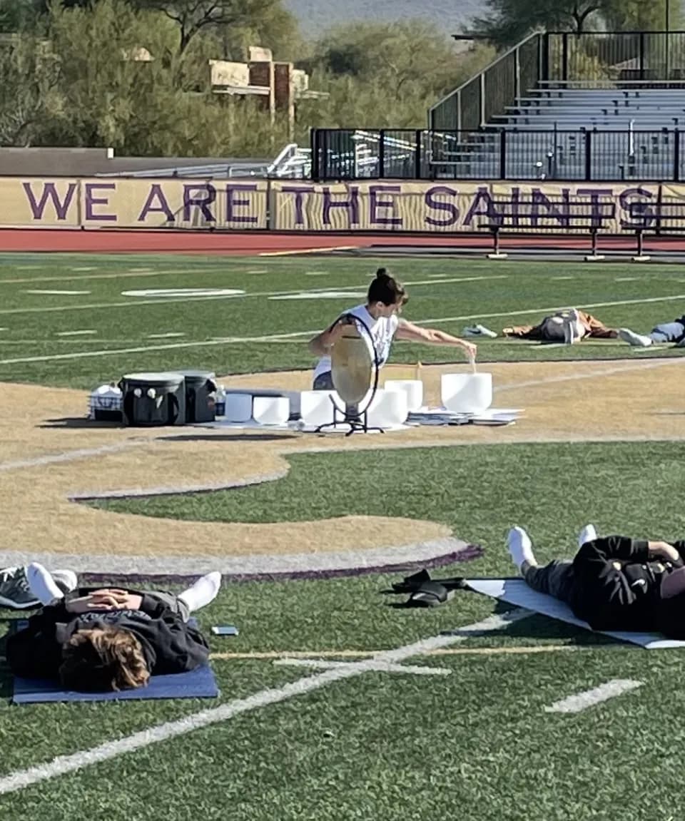 Victoria leading an outdoor sound bath session