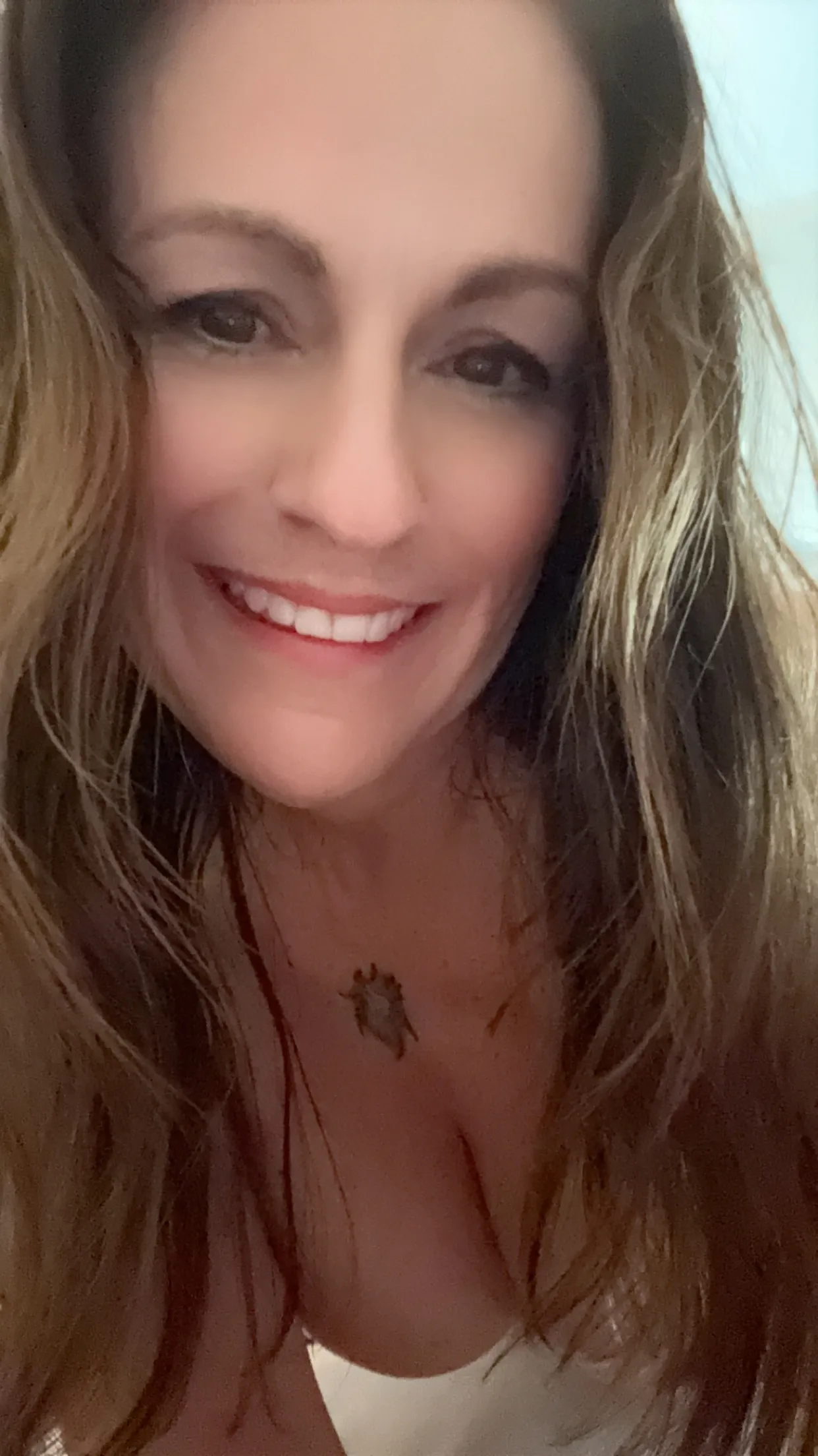 Crystal singing bowls on wooden shelf with mallets