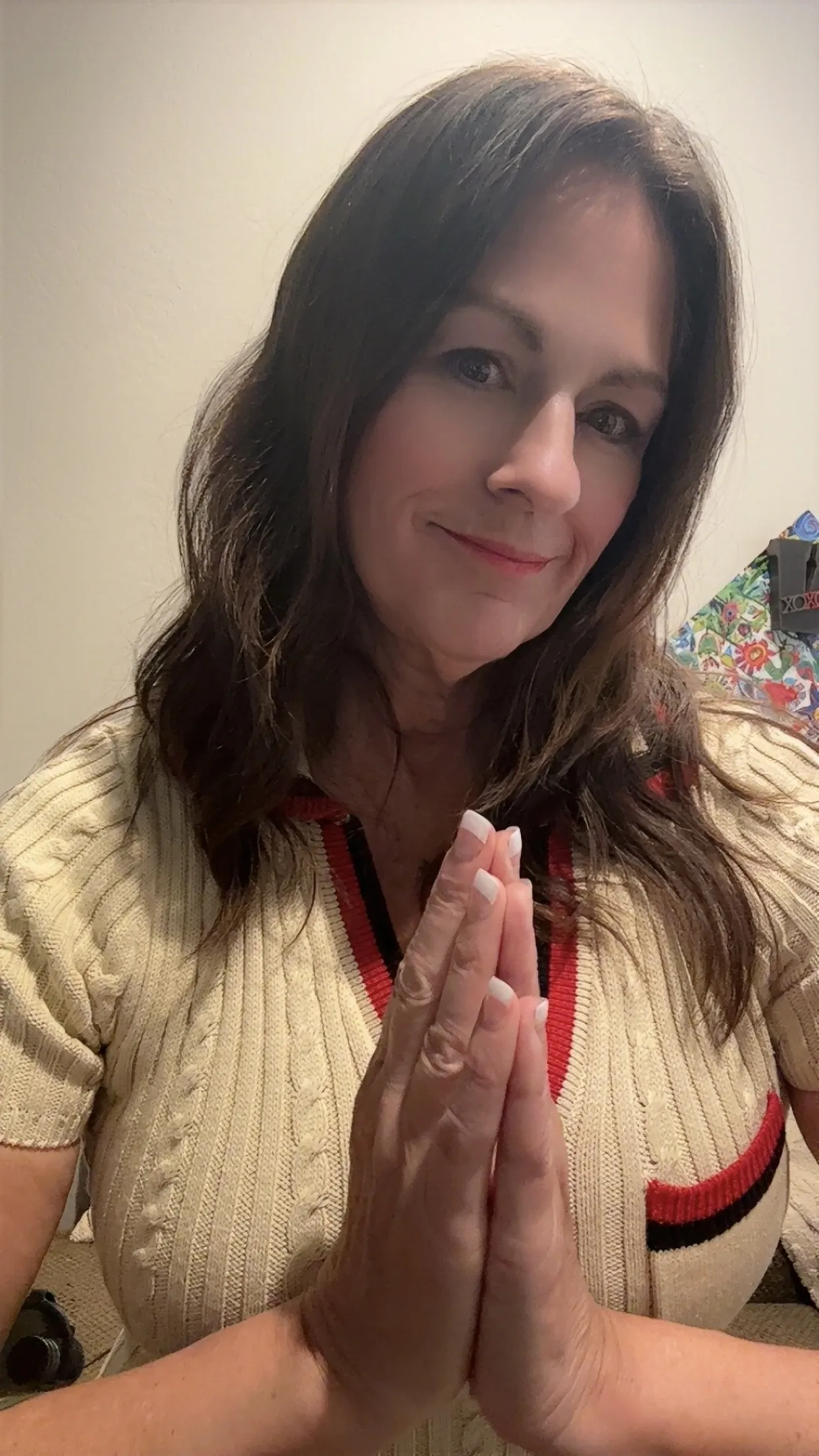 Victoria in a prayer pose