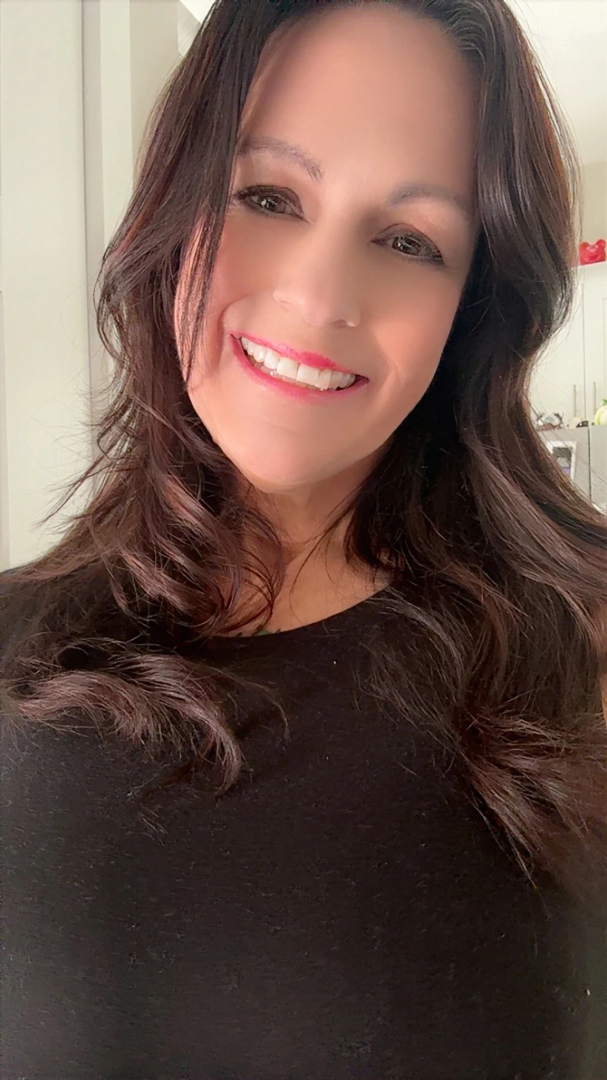 Victoria with singing bowls and gong by the pool at sunset